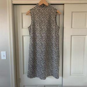 Cheetah dress, straight fit w/high neckline. Zipper in back. Size:XL